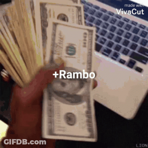 A Person Is Holding A Stack Of Money With The Words + Rambo On It GIF