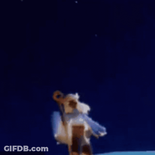A Person Is Holding A Stick In Front Of A Fireworks Display . GIF