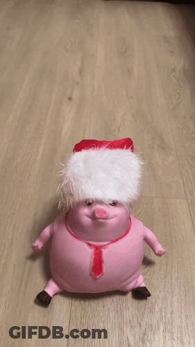 A Person Is Holding A Stuffed Animal On A Wooden Floor GIF