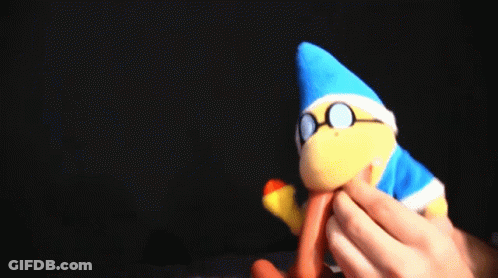A Person Is Holding A Stuffed Animal With A Blue Hat And Glasses On It . GIF