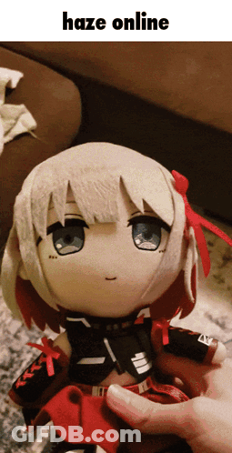 A Person Is Holding A Stuffed Doll That Says Haze Online On It GIF
