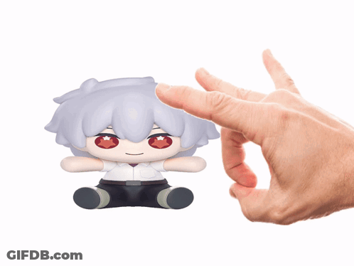 A Person Is Holding A Stuffed Toy With A Red Star On Its Eyes GIF