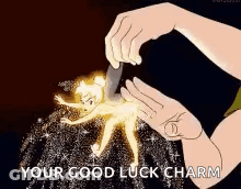 A Person Is Holding A Tinkerbell Figurine With A Knife And Saying `` Your Good Luck Charm '' . GIF