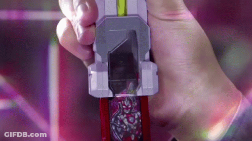 A Person Is Holding A Toy In Their Hand That Looks Like A Knife GIF