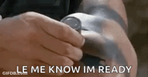 A Person Is Holding A Watch On Their Wrist And The Words `` Le Me Know Im Ready '' Are Visible . GIF