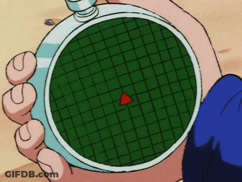 A Person Is Holding A Watch With A Red Triangle In The Center GIF