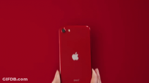 A Person Is Holding A White Apple Iphone GIF