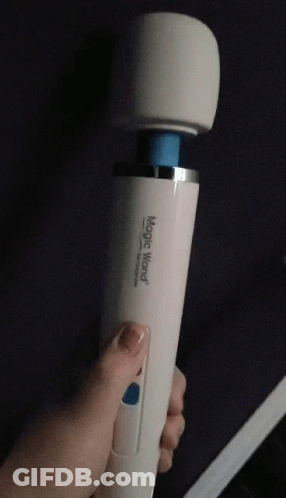 A Person Is Holding A White Magic Wand With A Blue Tip GIF