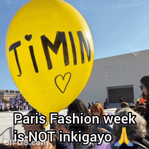 A Person Is Holding A Yellow Balloon That Says ' Jimin ' On It GIF