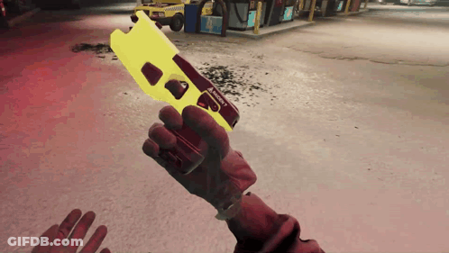 A Person Is Holding A Yellow Taser In Their Hand In A Video Game GIF