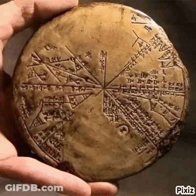 Person Holding Ancient Stone With Writing GIF