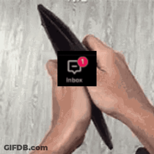 A Person Is Holding An Empty Wallet With An Inbox Notification On The Screen . GIF