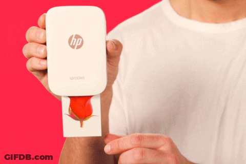 A Person Is Holding An Hp Sprocket In Their Right Hand GIF