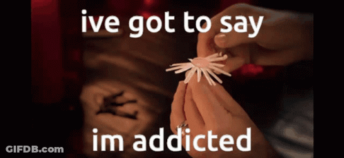 A Person Is Holding Something In Their Hands With The Words Ive Got To Say Im Addicted GIF