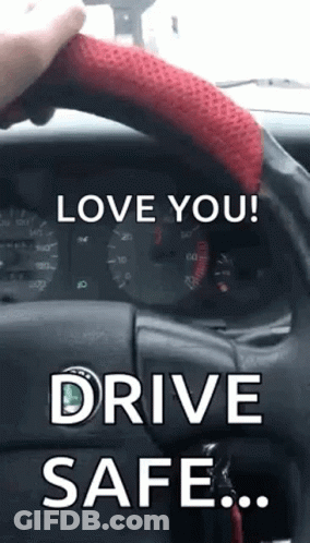A Person Is Holding The Steering Wheel Of A Car With The Words `` Love You ! Drive Safe . '' GIF