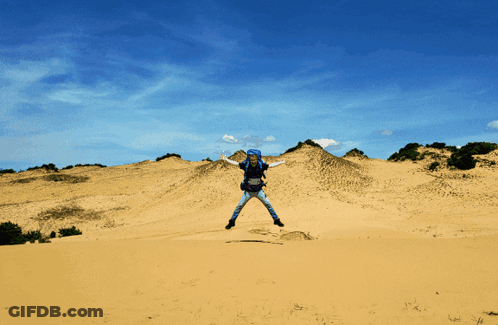 A Person Is Jumping In The Air While Wearing A Blue Helmet GIF