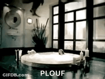 A Person Is Jumping Into A Bathtub In A Bathroom With A Sign That Says Plouf . GIF