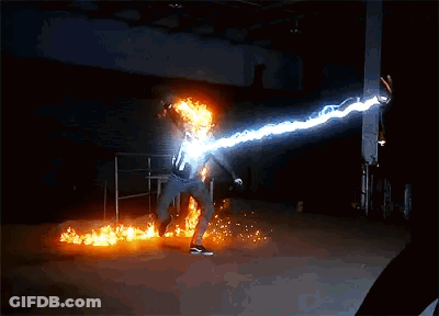 A Person Is Kicking A Ball Of Fire With Lightning Coming From It GIF