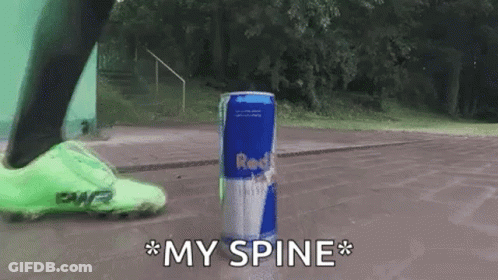 A Person Is Kicking A Can Of Red Bull In The Air GIF