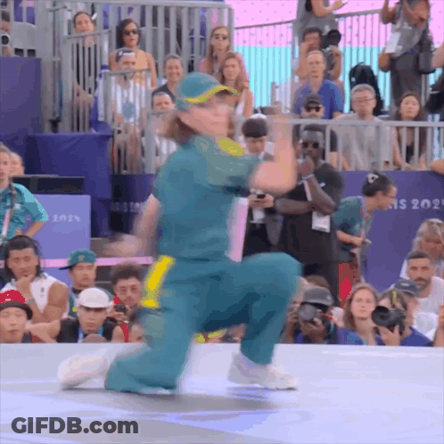 A Person Is Kneeling Down In Front Of A Sign That Says Ns 2021 GIF