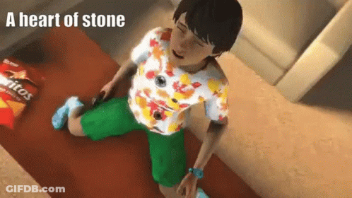 A Person Is Kneeling Down Next To A Bag Of Doritos Chips . GIF