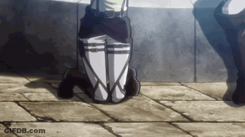 A Person Is Kneeling Down With Their Legs Crossed In Front Of A Wall With The Letters Sbs Visible GIF