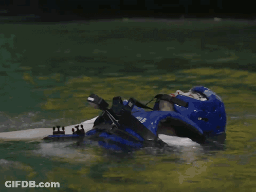 A Person Is Laying In The Water With The Word Wasted Written Above Them GIF