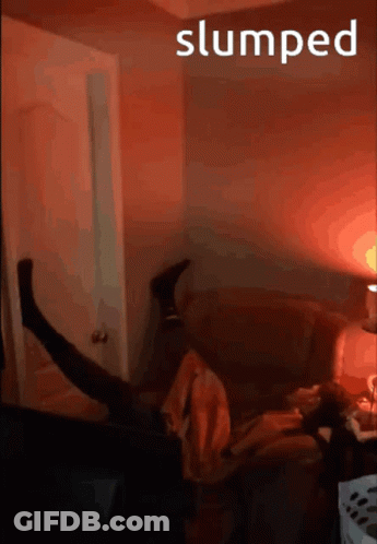 A Person Is Laying On A Couch With The Word Slumped Behind Them GIF
