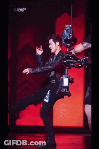 A Person Is Laying On A Red Surface With The Words Romantic Planet Written On The Bottom . GIF