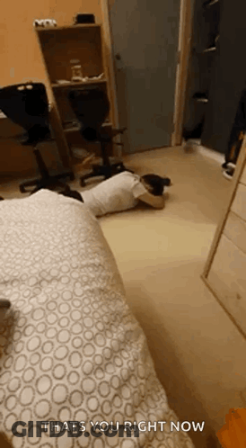 A Person Is Laying On The Floor In A Bedroom With The Words `` Thats You Right Now '' Written On The Bottom . GIF