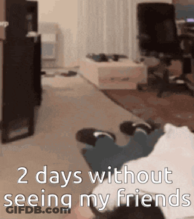 A Person Is Laying On The Floor In A Living Room With The Words 2 Days Without Seeing My Friends GIF