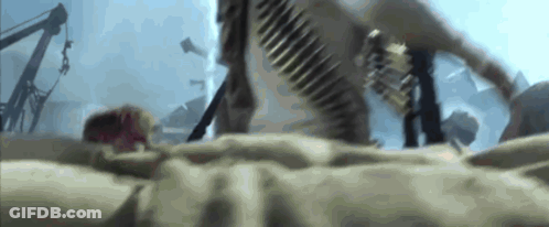 A Person Is Laying On The Ground With A Bullet Belt Around Their Waist GIF