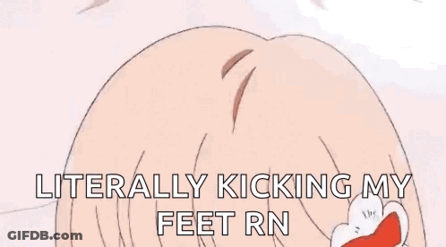 A Person Is Laying On Their Stomach On A Bed In A Room With A Desk And A Table . GIF