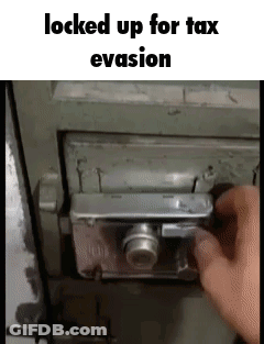 A Person Is Locking Up A Safe With A Camera Lock . GIF