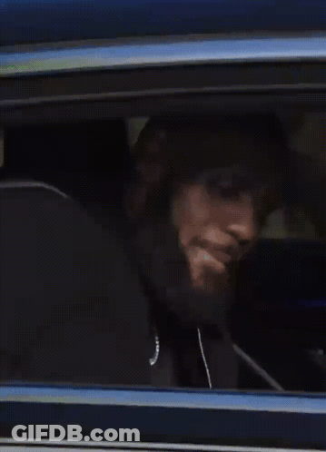 A Person Is Looking Out Of A Window Of A Car GIF