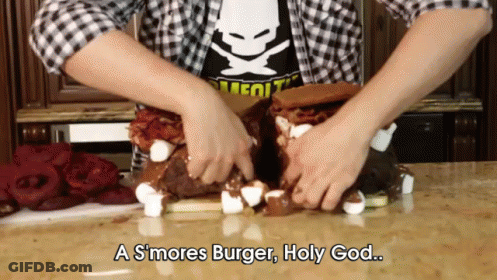 A Person Is Making A S'mores Burger With Marshmallows And Bacon GIF
