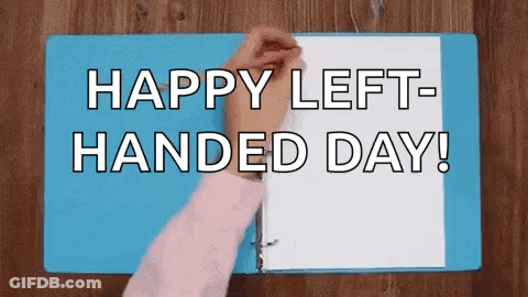 A Person Is Opening A Blue Binder With The Words `` Happy Left-Handed Day ! '' GIF