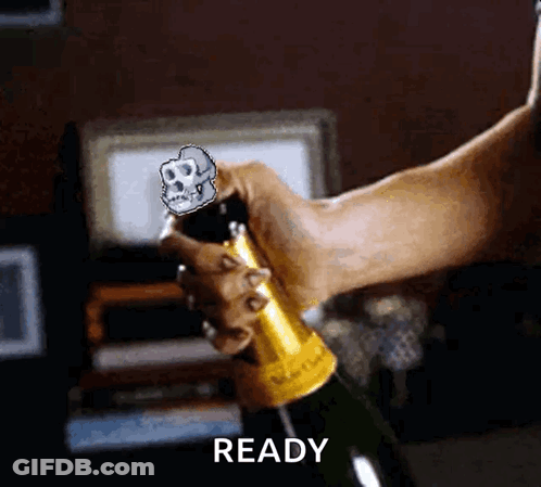 A Person Is Opening A Bottle Of Champagne With A Skull On The Cork And The Word Ready Below It GIF
