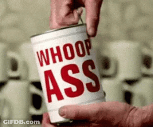 A Person Is Opening A Can Of Whoop Ass Soup . GIF