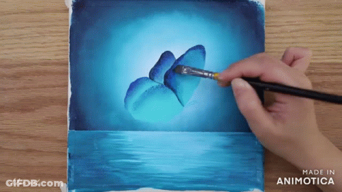 A Person Is Painting A Blue Butterfly With A Brush On A Piece Of Paper That Says Made In Animatica GIF