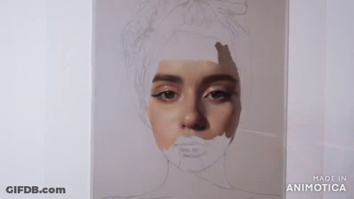 A Person Is Painting A Portrait Of A Woman With A Brush . GIF