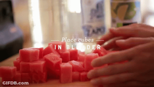 A Person Is Placing Cubes In A Blender With The Words Place Cubes In Blender Below Them GIF