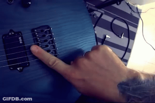 A Person Is Playing A Blue Guitar With A Pickup That Says Emg On It GIF