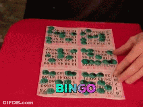 A Person Is Playing A Game Of Bingo On A Table GIF