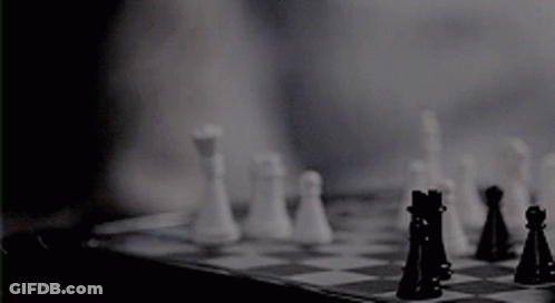 A Person Is Playing A Game Of Chess With Their Fingers . GIF