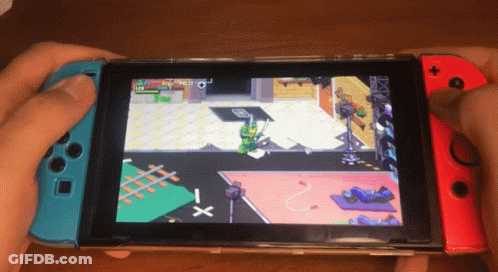 A Person Is Playing A Game On A Nintendo Switch With A Turtle On The Screen GIF