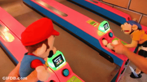 A Person Is Playing A Game With Mario And A Monkey GIF