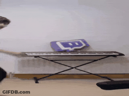 A Person Is Playing A Keyboard With A Twitch Logo On It GIF