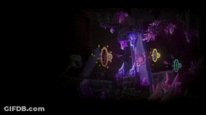 A Person Is Playing A Video Game In A Dark Room With A Lot Of Purple Lights . GIF