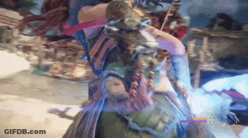 A Person Is Playing A Video Game With A Blue Light Coming Out Of Their Mouth . GIF